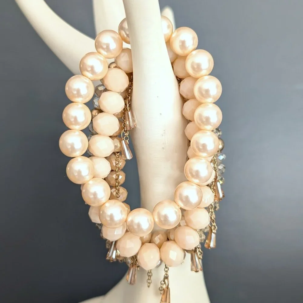 Bundle of nude and natural beaded stretch bracelets